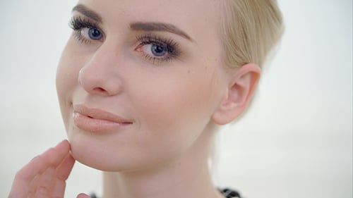Blonde Woman Posing with a Smile Close Up