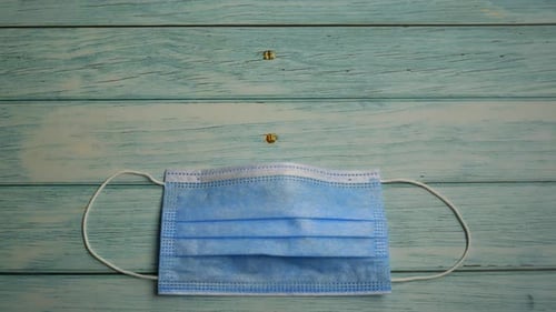 Protective Mask and Pills on Wooden Background Stop Motion Animation, Coronavirus Pandemic