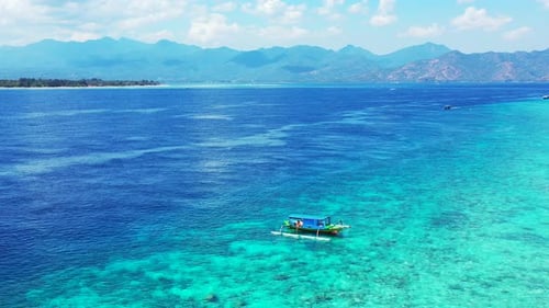 Wide flying tourism shot of a white paradise beach and turquoise sea background in colourful 4K