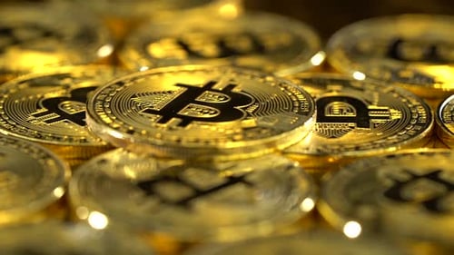 Bitcoin Coins Spin Lying on the Table. Close Up