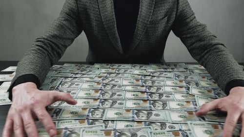 Greedy Businessman Man Takes Money From the Table for His Own Benefit