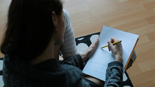 Relaxed Woman Drawing at Home