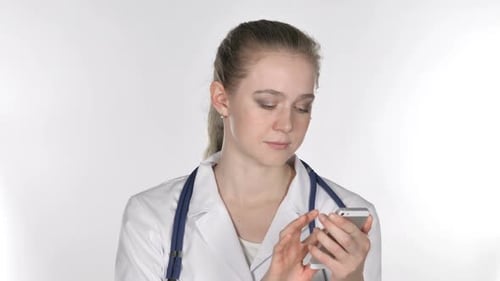 Woman Doctor Using Smartphone in Clinic
