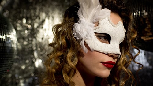 Glamorous Woman Wearing a Venetian Mask in Studio
