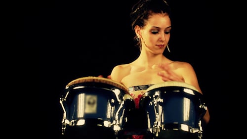 Woman Playing Bongos in Studio on Black Background