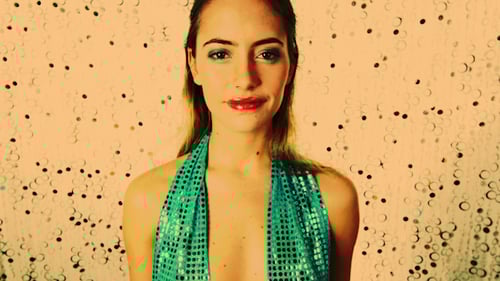 Glamorous Woman Posing with Sparkling Background