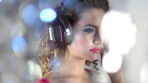 Woman with Retro Headphones Listening to Music