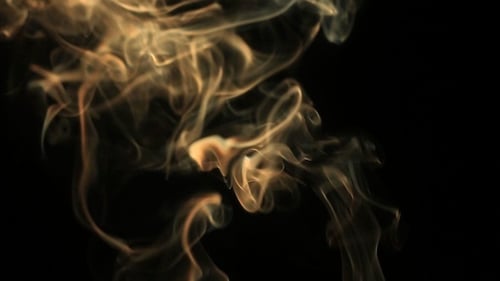 Golden Smoke Rising in Ethereal Patterns on Black