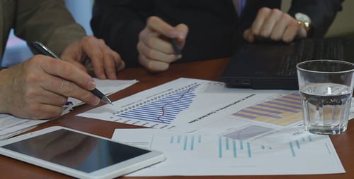 Business People Analyze Sales Figures
