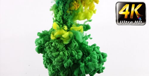 Yellow and Green Ink Swirling in Water