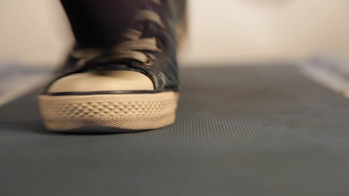 Close Up of Sneakers Walking on Treadmill