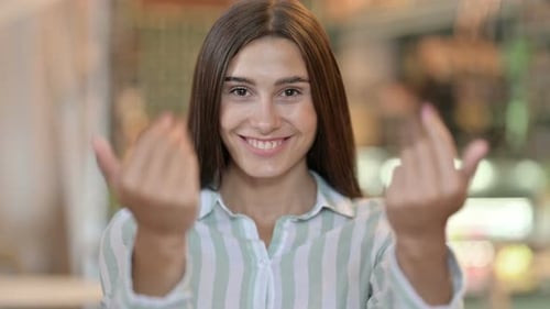 Assertive Young Latin Woman with Pointing and Inviting