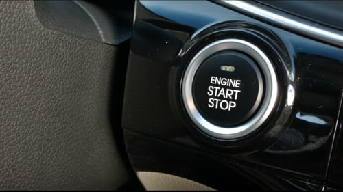 Finger Pushing Car Engine Start Stop Button