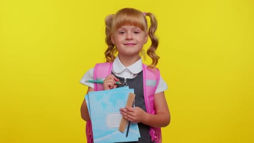 Attractive Teenage Girl Kid in School Uniform Smiling Make Pencil Notes in a Notebook Education