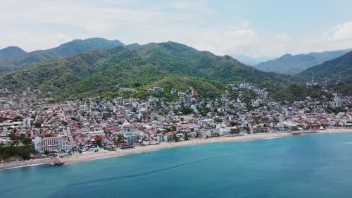 Aerial View of Coastal City and Mountains