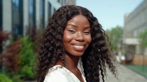 Smiling Young Woman Portrait in City