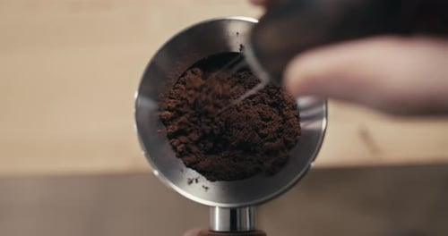 Spreading Fresh Ground Coffee for Delicious Espresso Shot