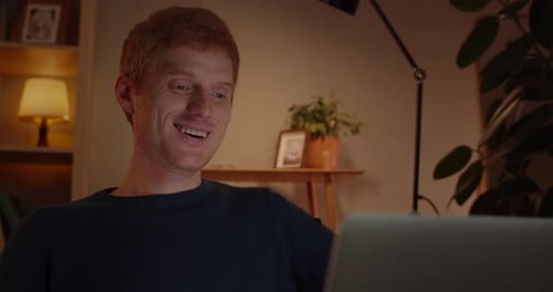 Crop View of Positive Red Haired Man Waving and Talking While Using Laptop for Having Conversation