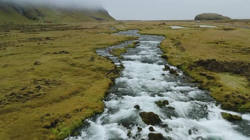 Aerial Flight Through Epic Iceland Landscape Over the Foss River
