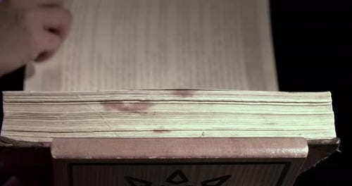 Ancient Book Pages Turning Slowly