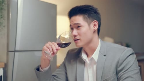 Loving Couple Toasting with Wine at Romantic Dinner