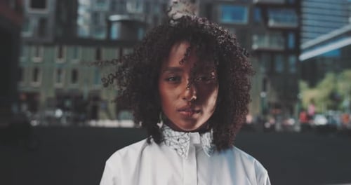 Serious young Afro American woman looks directly at camera
