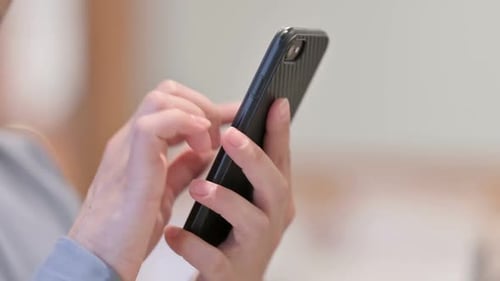 Hands Close Up of Woman using Smartphone