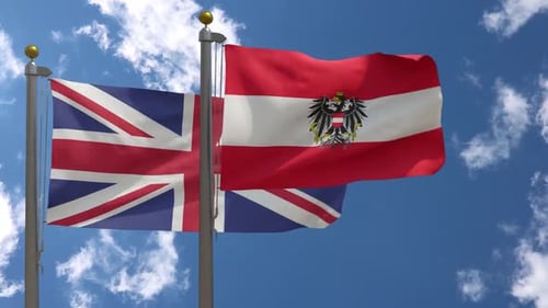Flags of United Kingdom and Austria Waving in Blue Sky