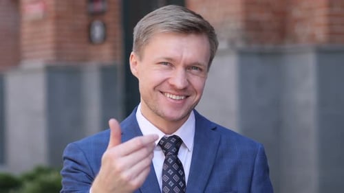 Inviting Gesture by Businessman