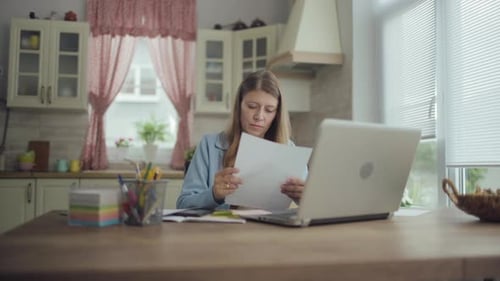 Beautiful Adult Woman Working At Home Computer On The Sofa