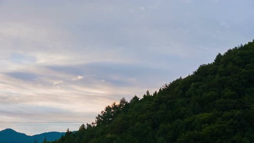 Lush Green Mountain Range at Sunset or Sunrise