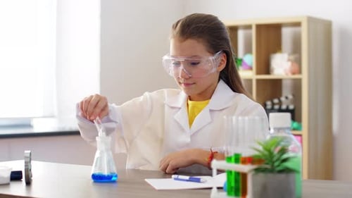 Young Girl Doing Science Experiment in Lab