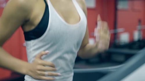 Close View Slim Girl in Sportswear Runs on Modern Treadmill