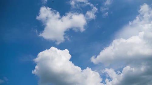 Timelapse of Clouds Moving Across Bright Blue Sky