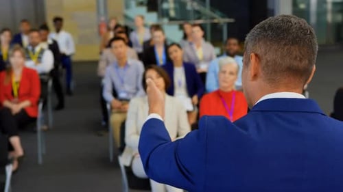 Man Giving Corporate Presentation to Diverse Audience