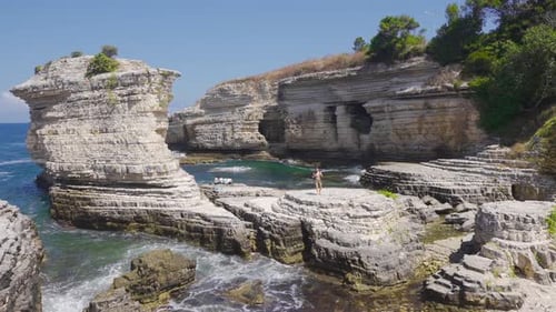 Aerial View of Stunning Rocky Coastline on Sunny Day