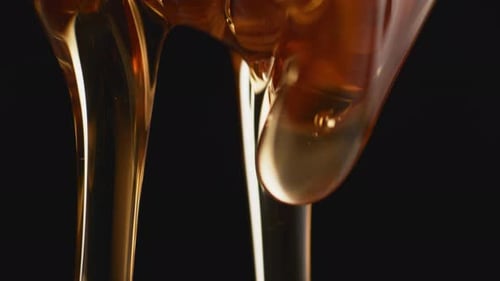 Thick honey dripping. Slow Motion.