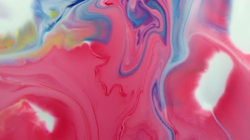 Mehrfarbige Acrylfarbe. Zeitlupe. Fantastische Oberfläche. Abstrakte farbige Farbe. Ansicht von oben