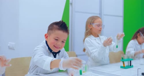 Enthusiastic Children Conducting Science Experiments in Classroom