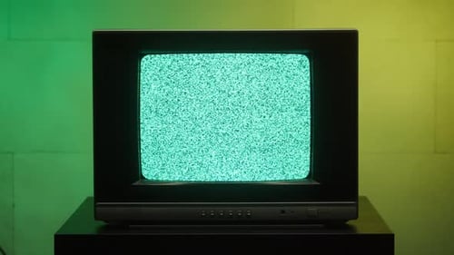 Old Retro Square Television on Green and Yellow Neon Background Screen with Ripples and Interference