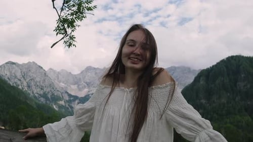 Portrait of Cheerful Girl in Mountain Countryside