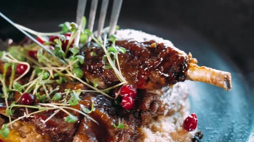 Close-up of Slicing the Appetizing Roasted Duck with Fork and Knife