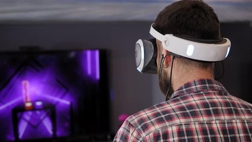 Man Wearing VR Headset Playing a Game