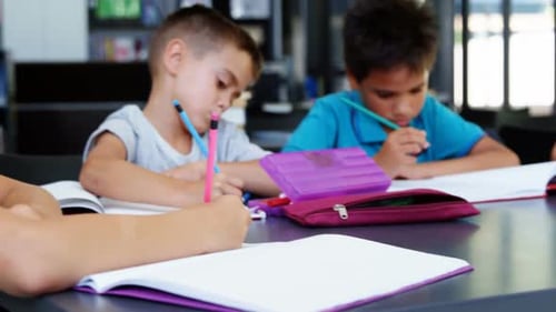 School kids doing homework in classroom