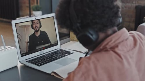 Student Participating in a Video Conference at Home