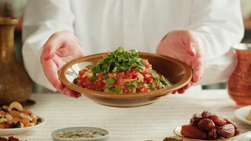 Woman Holds Dish of Middle Eastern Salad