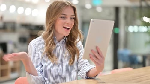Woman Uses Tablet for Online Video Call