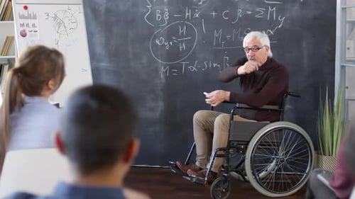 Lecturer with Disability Teaches Math in Classroom