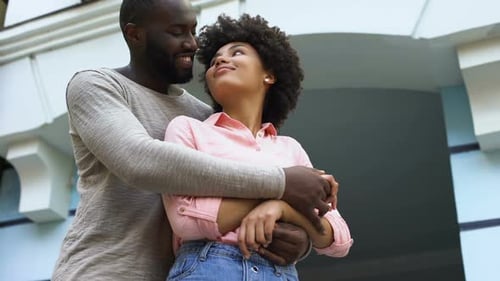 Affectionate Couple Embracing in Urban Setting