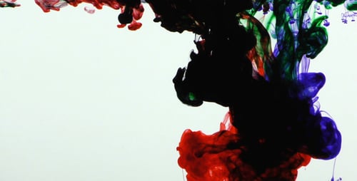 Colorful Ink Dissolving into White Liquid